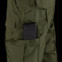 A black rifle magazine is partially inserted into a side pocket of the Condor Sentinel Tactical Pants in green.